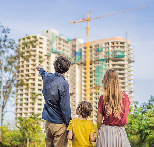family back and father pointing the building