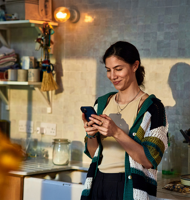 women using phone smiling