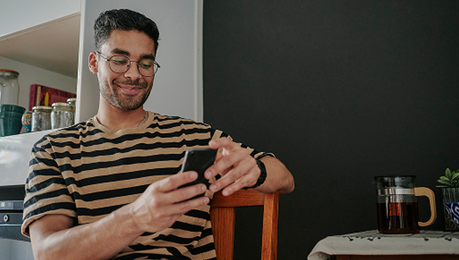 Man smiling with phone