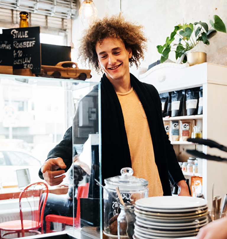 man with long hair smiling