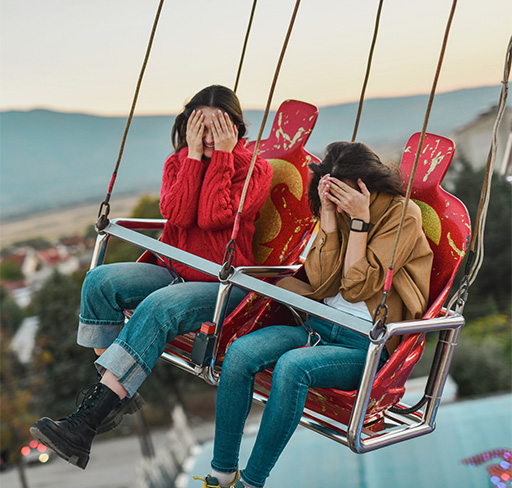 Two woman feeling excited in giant swing