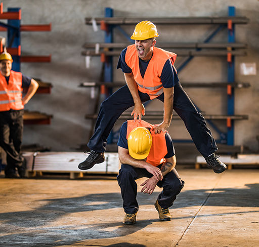 A worker jumps over coworker shoulder